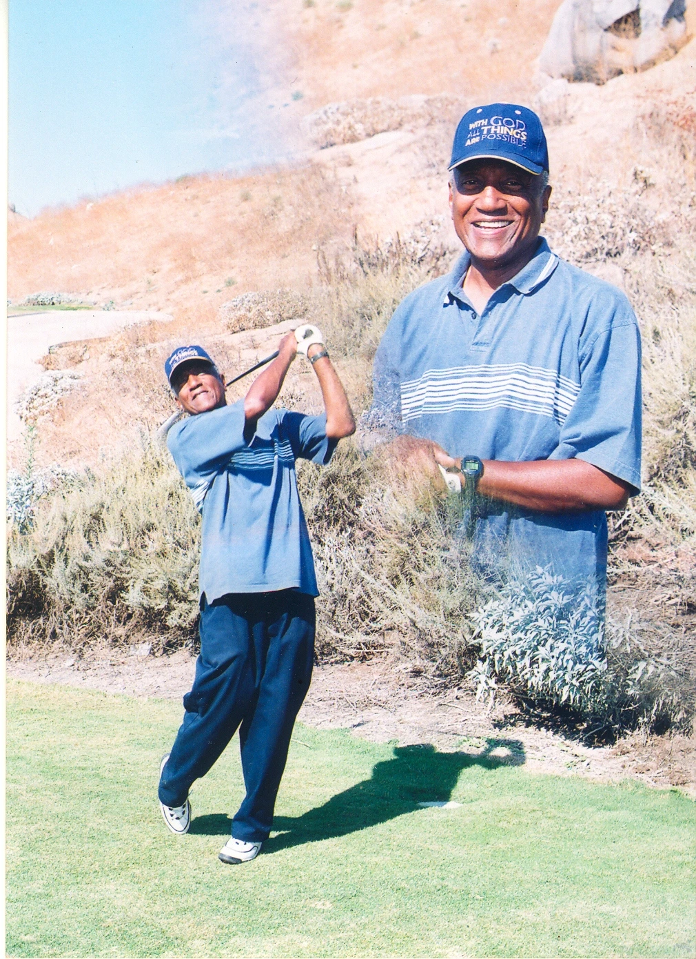 A young Loren Grant golfing alongside his father, Dr. Lorenzo Grant