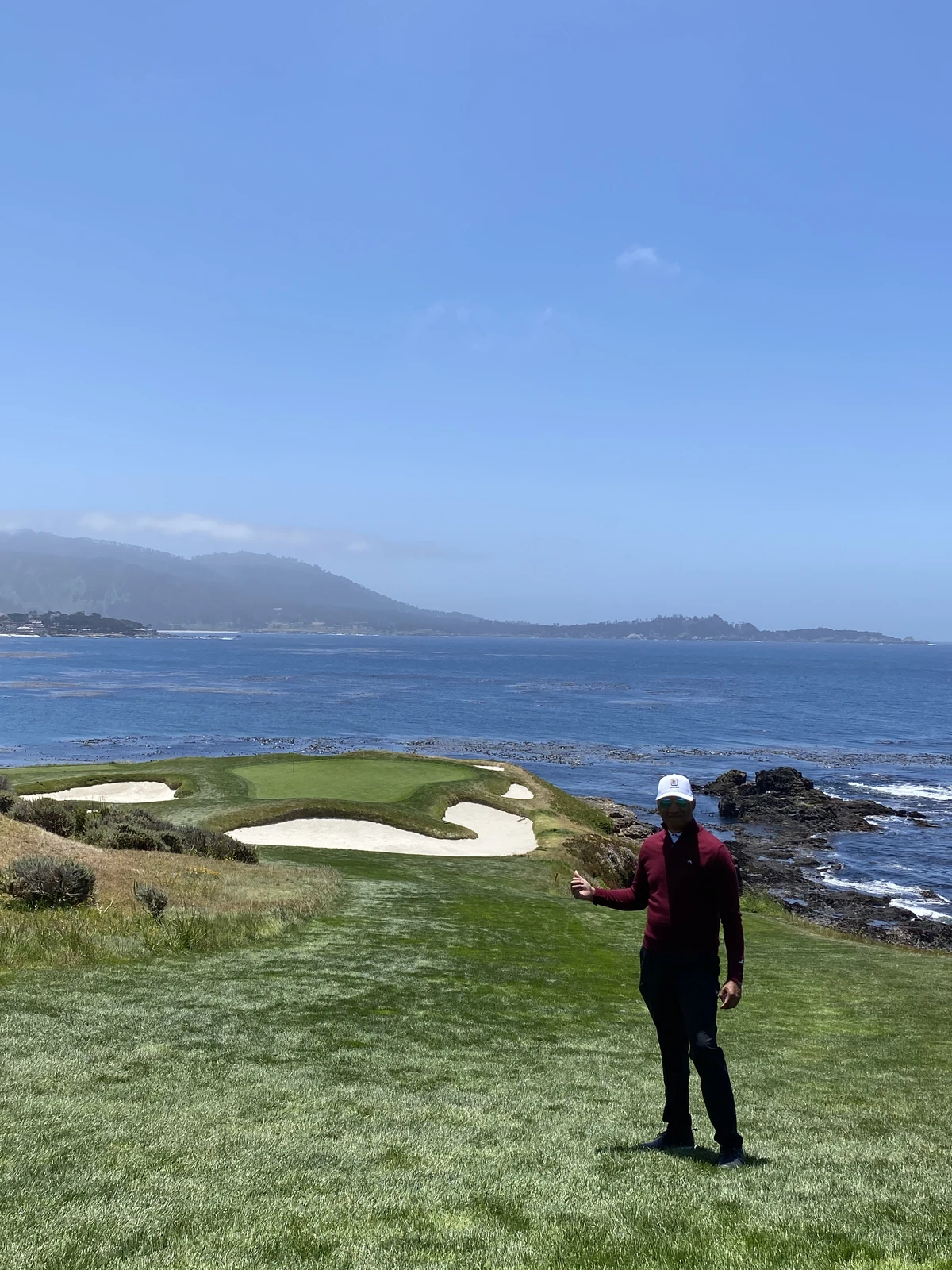 Pebble Beach Golf Links - iconic coastal view with bunkers and Carmel Bay