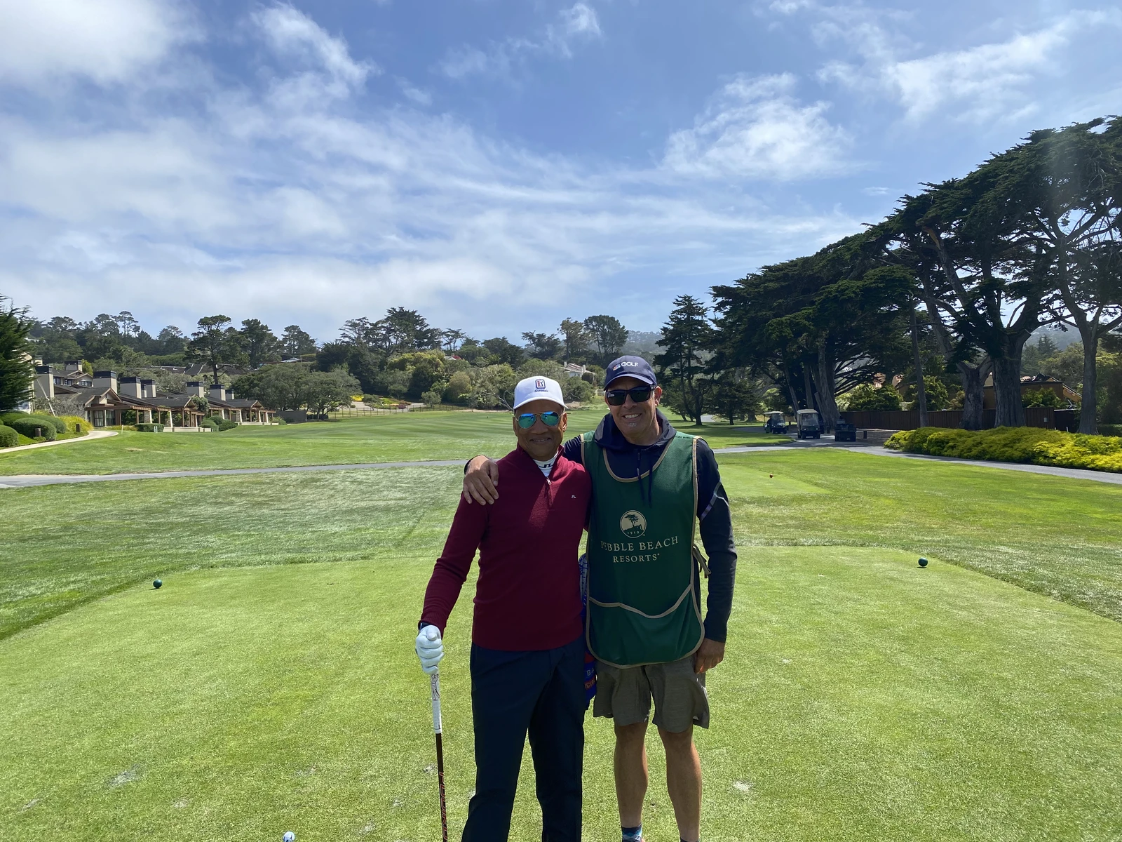 Golfer with a Pebble Beach Resorts caddie on the fairway