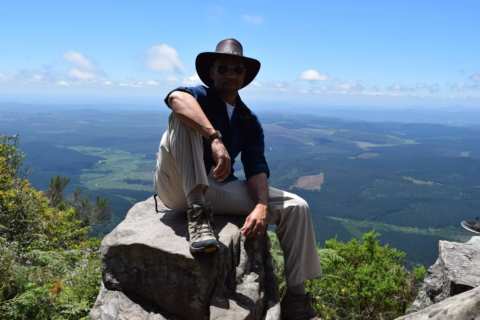 Resting on a boulder with the valley below